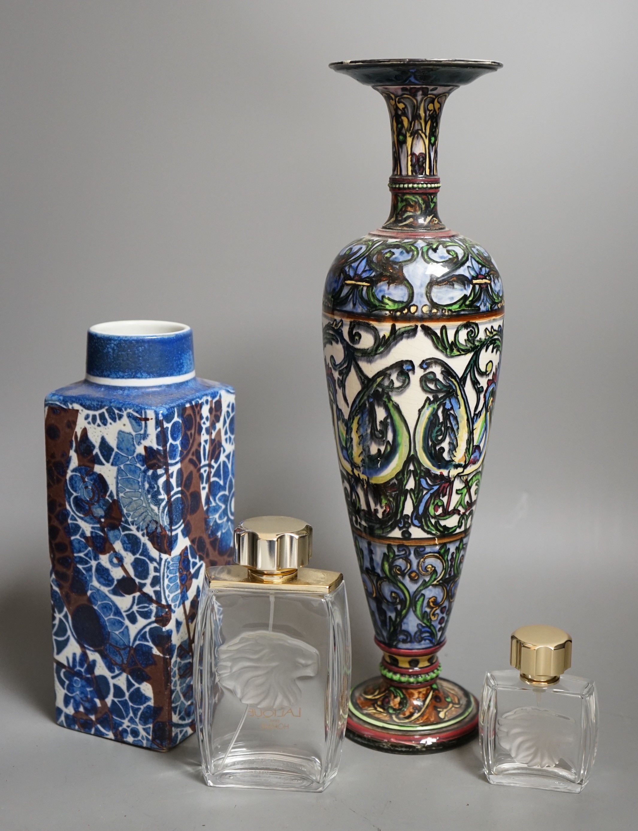 A Royal Copenhagen faience vase and a grotesque style bottle vase and two Lalique pour Homme perfume bottles, faience vase 23cms high